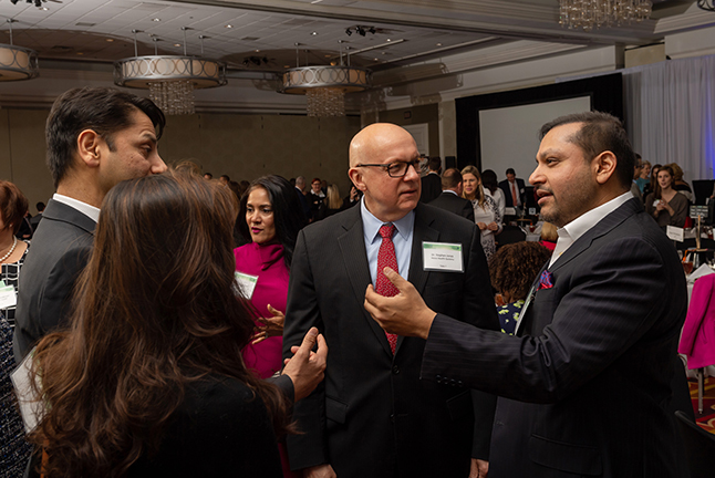 Business and community leaders networking at a event sponsored by Educate Fairfax.