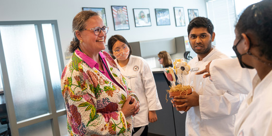 Dr. Reid receives cookies from students