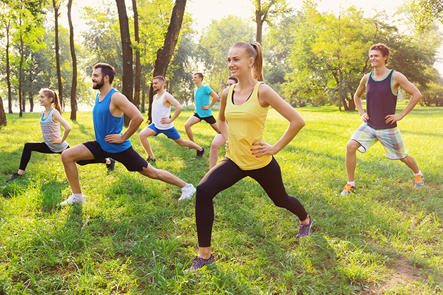 people work out in a park-like setting