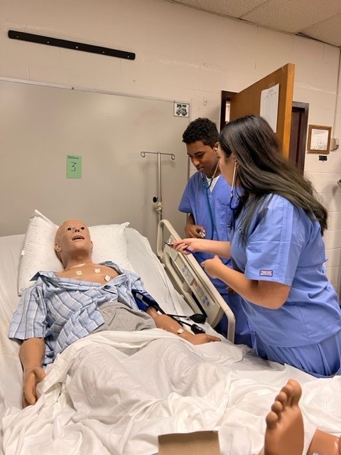 Students use simulation mannequin to learn various medical skills