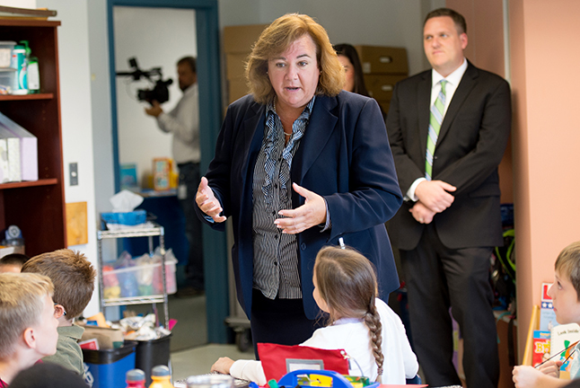 Principal speaking with students