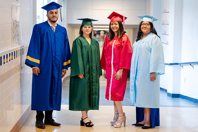 Students dressed in cap and gown