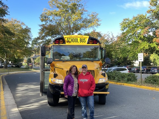 Anne Bridges and Ms. Tholen in front of Ms. Bridge's FCPS school bus