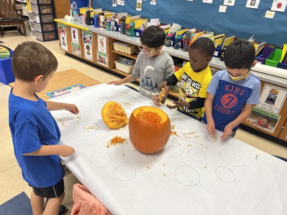 Kindergarten students with pumpkin