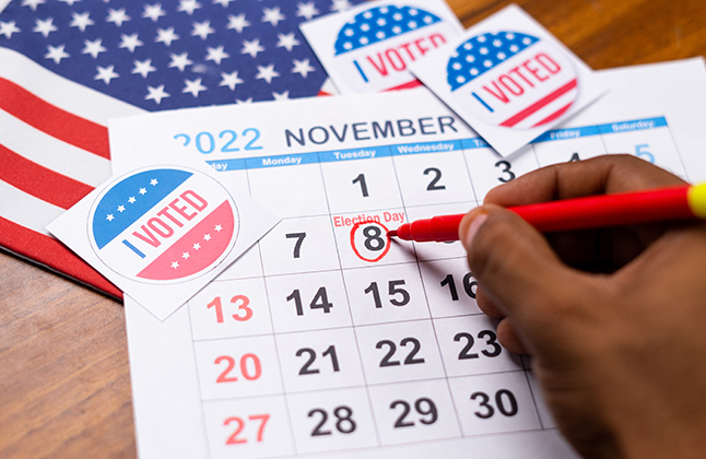 A calendar with Nov. 8 circled and "I voted" stickers