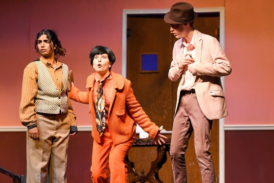 Three students act in a high school play