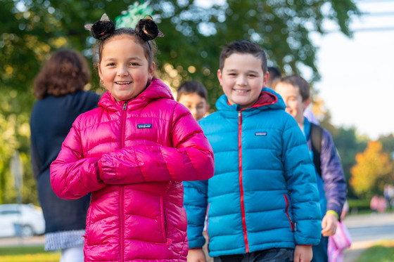 photo of children dressed in warms coats outside