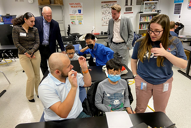 FCPS leaders from Poe MS and Capital One volunteers give tour of Capital One's acclaimed Coders program.