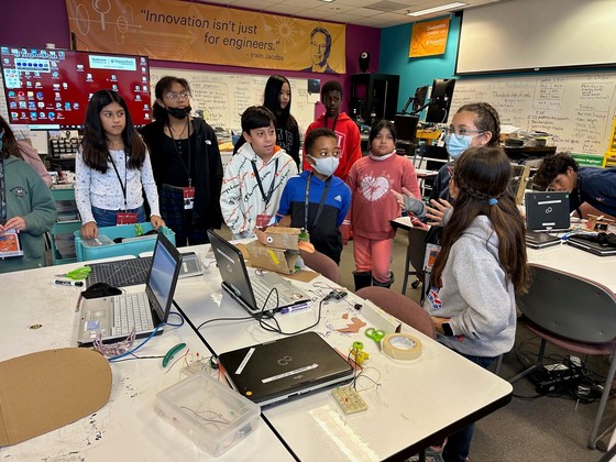 An image shows students from Clermont's Young Scholars program on a field trip to Thinkabit Labs in Falls Church. 