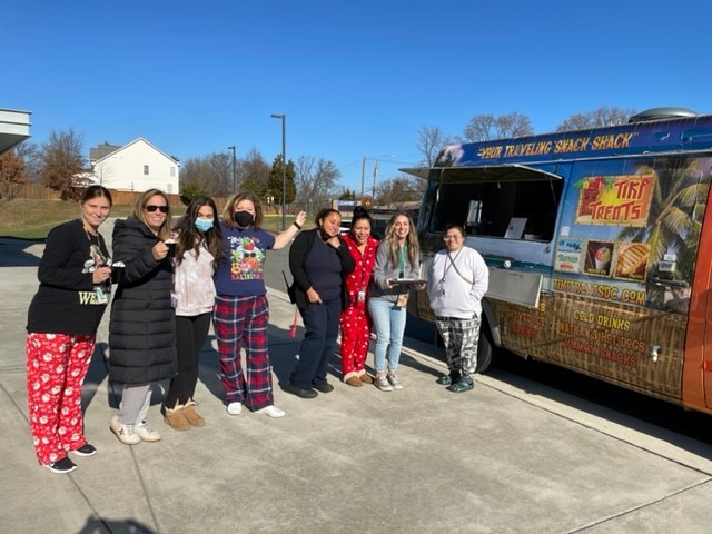 An image of Clermont staff members in front of Maui Wowi Hot Chocolate truck.