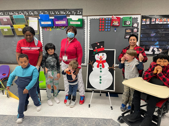 students with a snowman