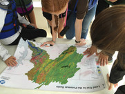 Image of students analyzing a map of the Chesapeake Bay on a field trip.