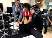Image of students collaborating on a chemistry lab.