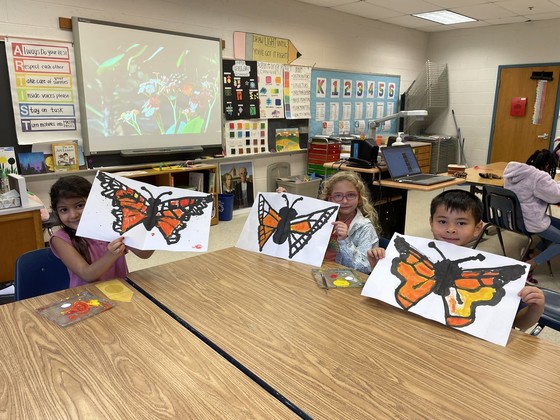 students with butterfly paintings