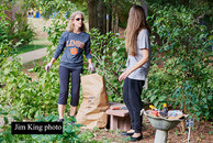Two female St. Matthews Methodist parishioners involved in a schoolyard cleanup.