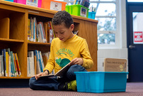 Student reading in library