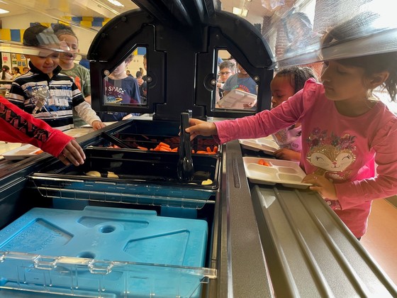 Students learning to use the new salad bar in the Weyanoke cafeteria