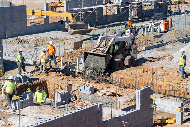 A school foundation being laid. 