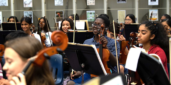 Strings students preparing to play music