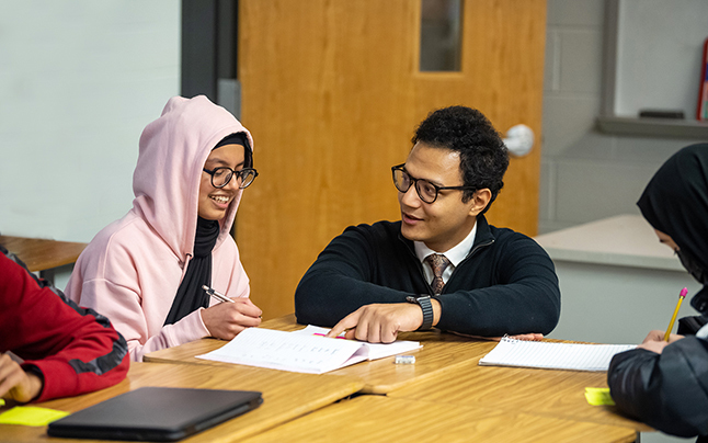 Teacher working with student