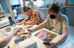 students work on art