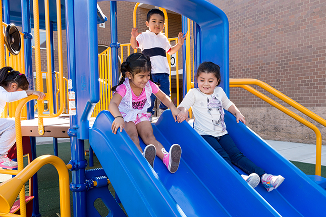 students on a slide