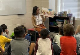 Librarian reading to students