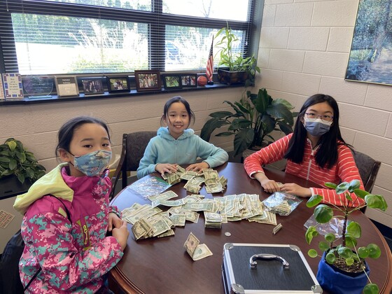 students with fundraising money