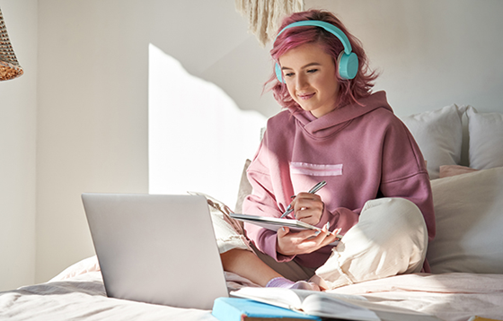 Student accessing teletherapy on laptop