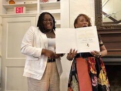 Student Representative to the School Board Michele Togbe receiving Princeton Peace Prize in Race Relations award