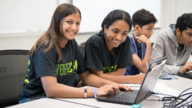 students working together on laptop