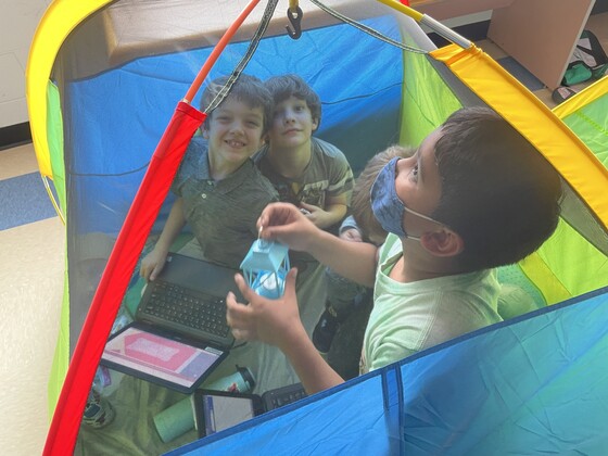 students in tent
