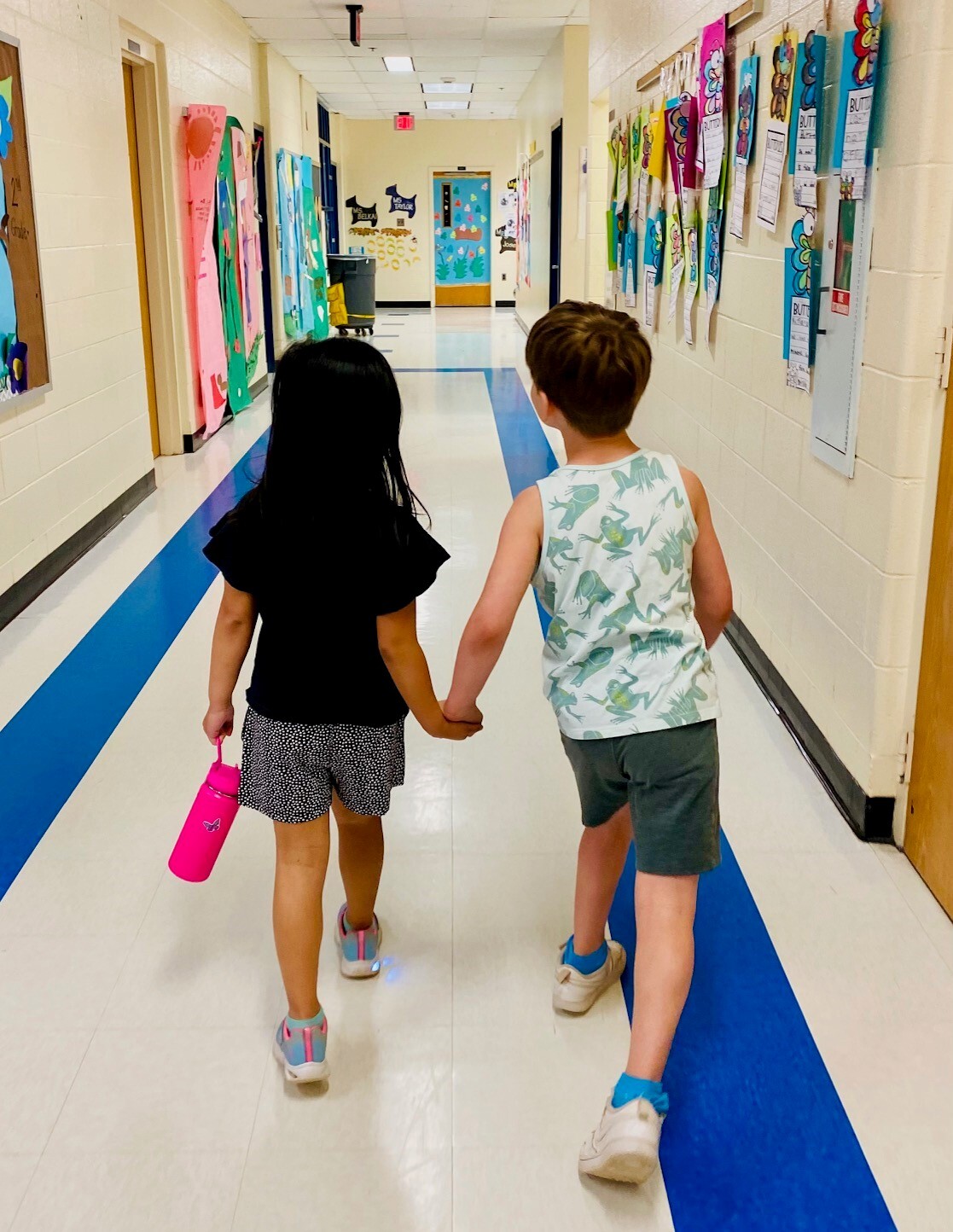 holding hands and walking in the hallway