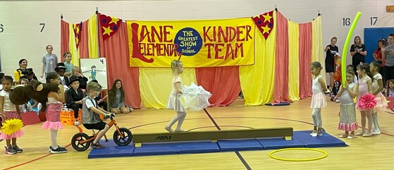 Students performing on a balance beam