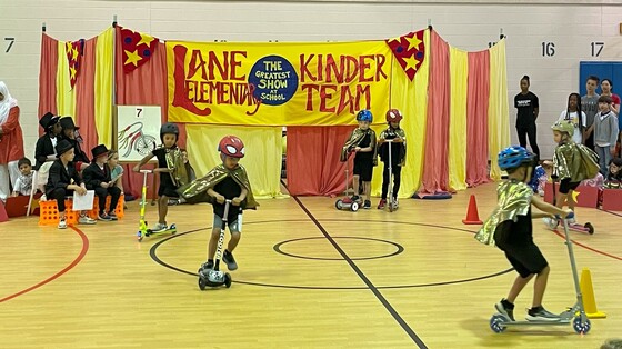 Students riding scooters