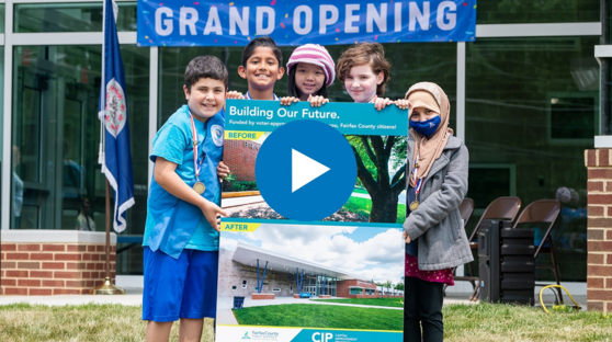 Elementary students in front of school