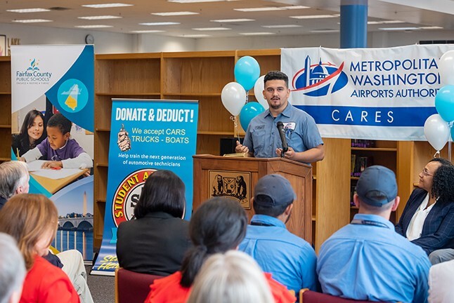 Man speaking behind podium