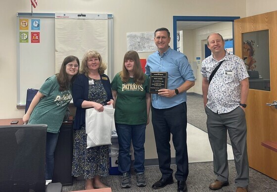 Assistant Principal Kevin Greata, Mr. and Mrs. Avila, and their daughters.