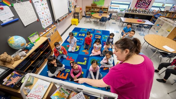 teacher working with students