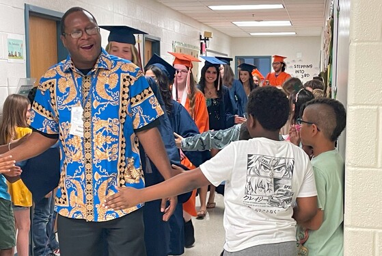 Mr. Dickens leading the graduate parade