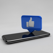 photo of a cell phone, with a blue box and white thumbs up coming from the screen