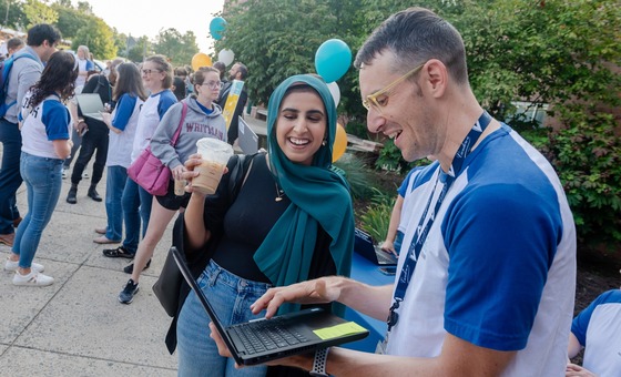 teacher checking in new teacher