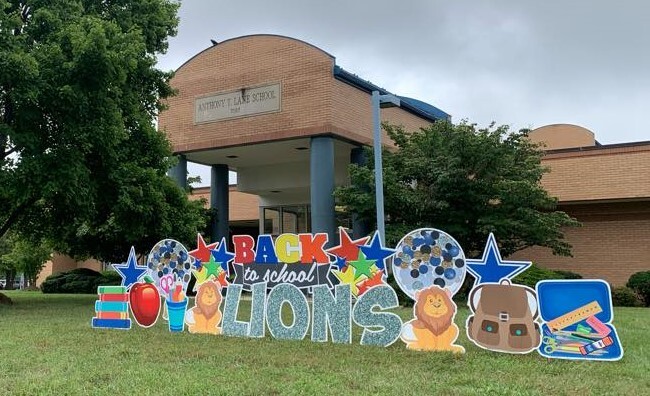 welcome back to school Lane Lions sign in front of the school