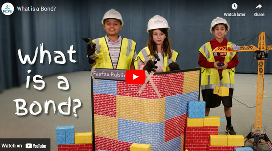 Children wearing construction hats and vests with construction toys