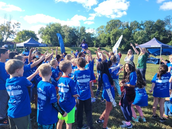 Students cheer while participating in the Boosterthon Fun Run. 