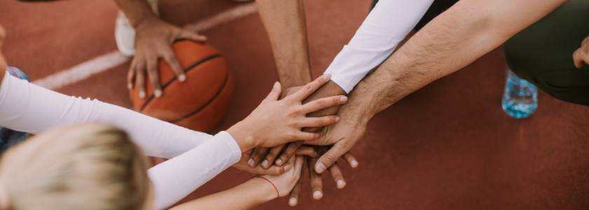 photo of group of adults hands in a circle