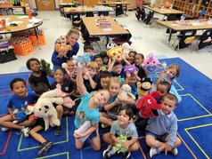 Students in classroom with stuffed animals