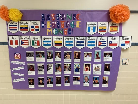 Hispanic Heritage Month display in our hallway with flags from Spanish-speaking countries