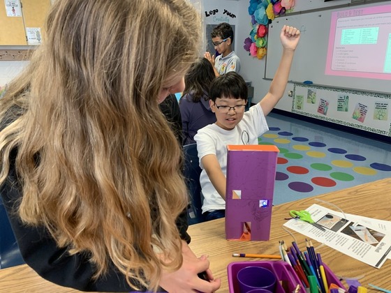 Student celebrates successfully lighting an LED