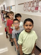 Students lined up in the hallway